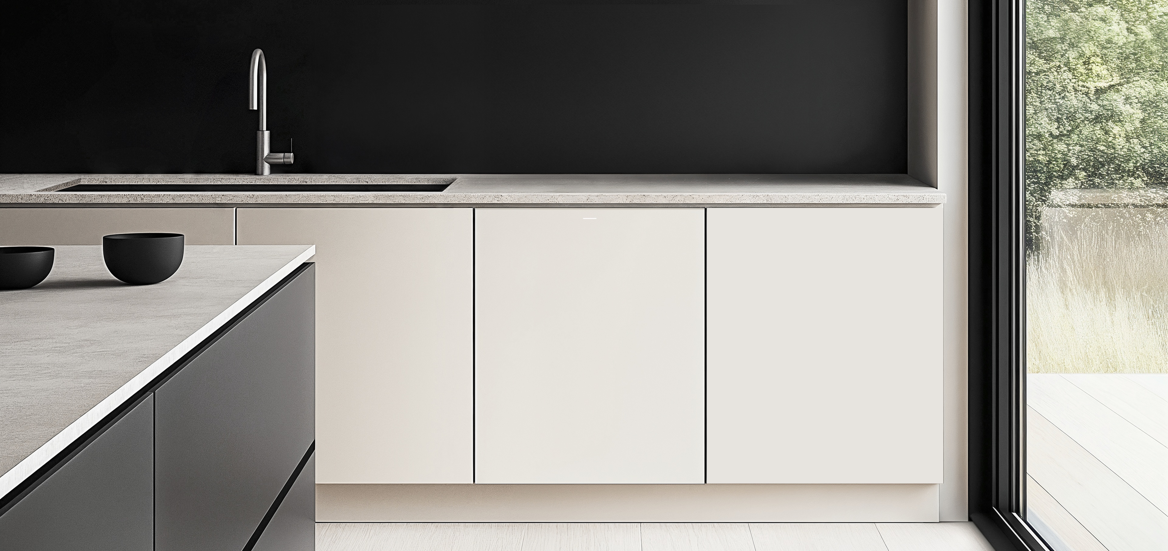 A White kitchen with a large window on the right, partially revealing trees outside. Next to the window, a modern lower cabinet seamlessly integrates the 2025 BESPOKE AI Dishwasher.